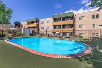 A swimming pool in front of a building.